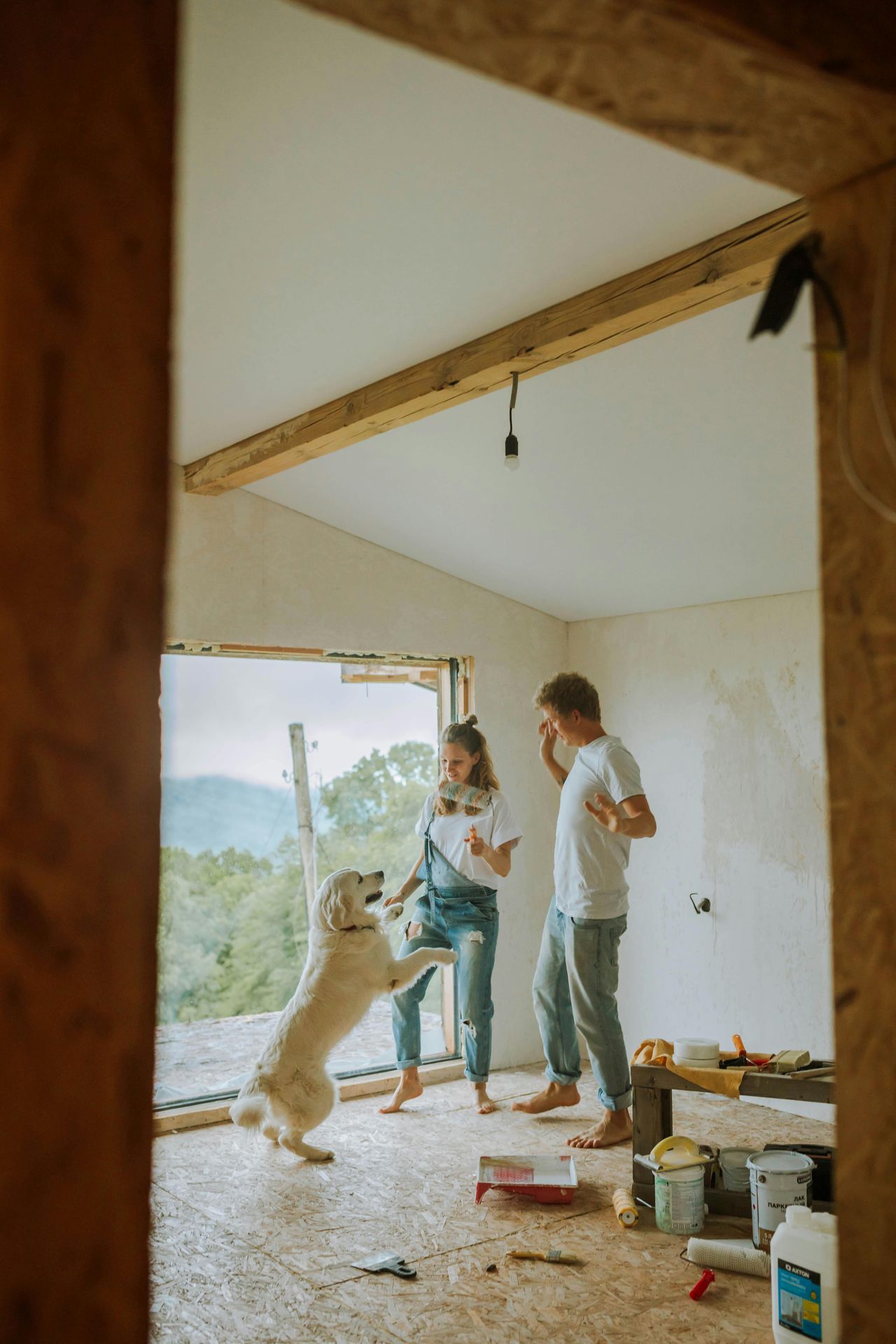 A family and their dog feeling happy in their new home