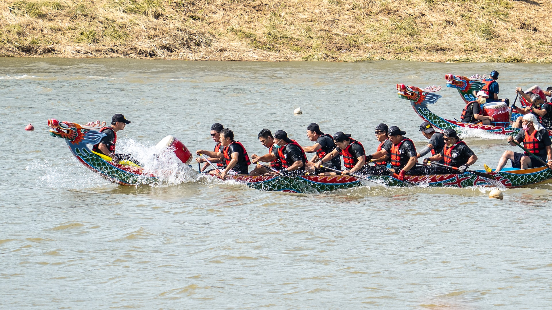 a group of people riding on top of a boat in the water